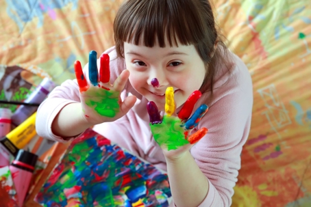 Child with paint hand