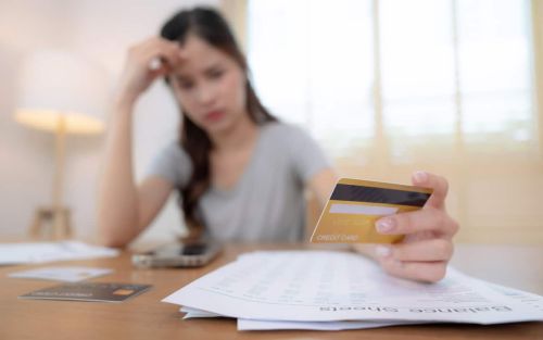 Stressed woman preparing a financial statement. Visual concept for a divorce blog discussing the importance of accuracy in a divorce financial statement.
