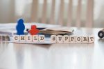 Word CHILD SUPPORT composed of wooden letters. Visual concept for a family law blog discussing important changes made to Maryland Child Support Laws