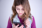 Girl with smartphone - Technology to Connect with Your Kids - Law Office of Shelly Ingram